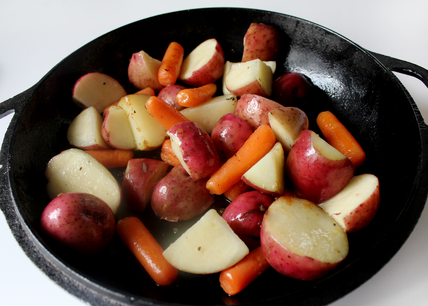 cookveggiesinoliveoilfor10minutesformat1500w | Tag and Tibby Cook carrots, potatoes in cast iron skillet