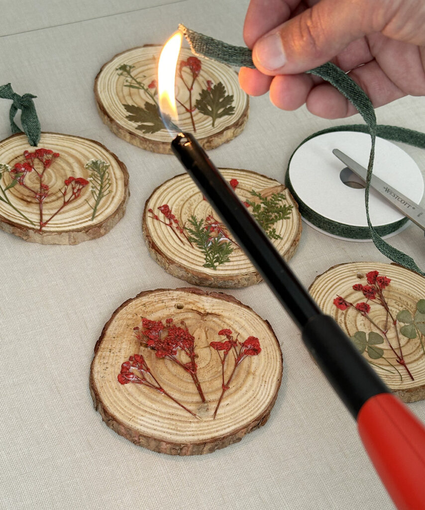 burnribbonandtie | Tag and Tibby Used a candle lighter to make the edge of my ribbon more stiff and easier to slide through the ornament hole.