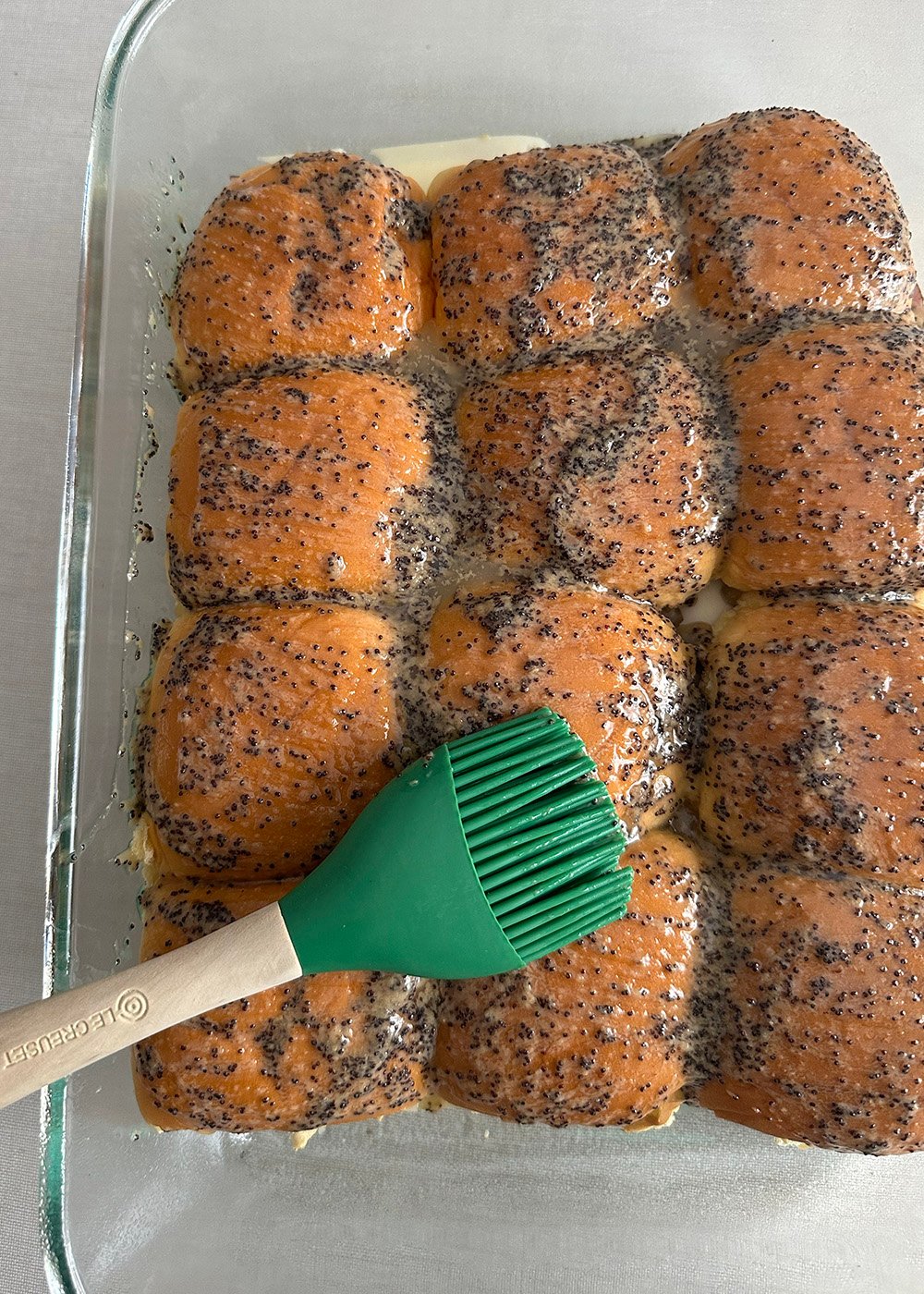 whiskpourover | Tag and Tibby Brush on the butter poppyseed mixture over the top of the dinner rolls.